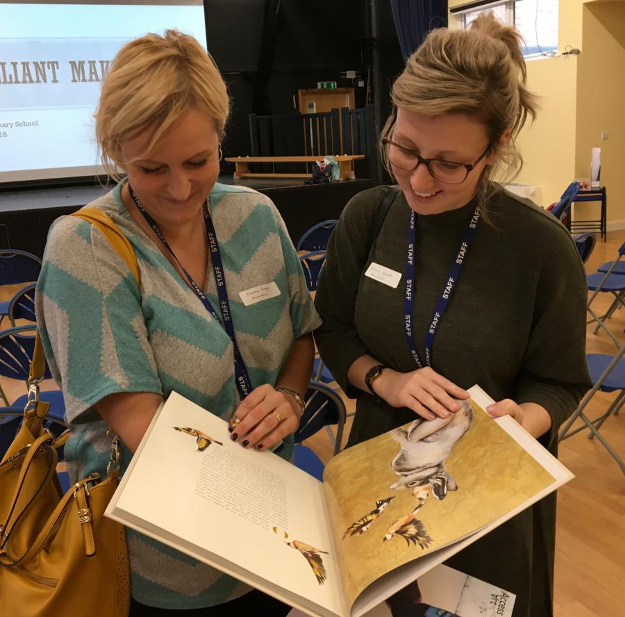 Teachers looking at the Lost Words book